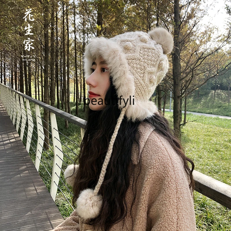 Korean versionof cute rabbit fur piled and thickened Japanese women's winter snowy days warm ear protectors hairball knitted hat