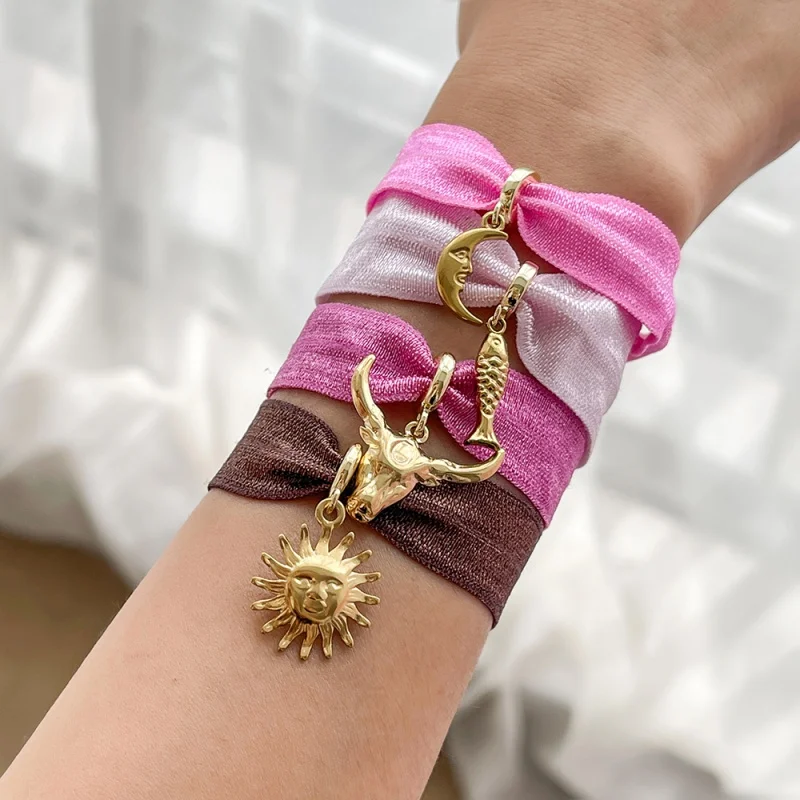 Titanium Steel Elastic Bracelet with Bull Head, Moon, Sun, and Small Fish Charms