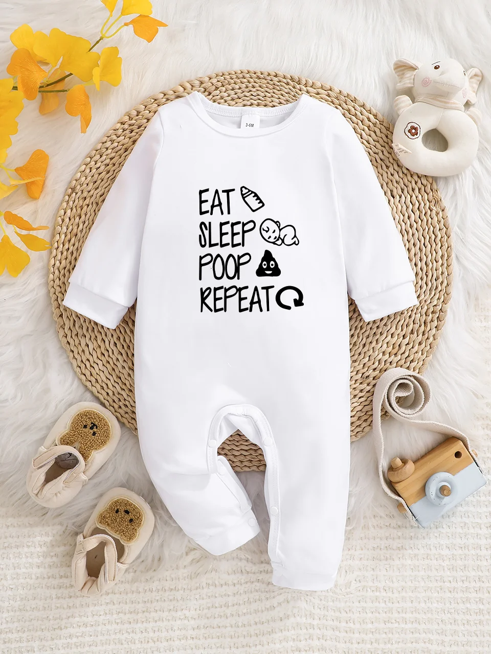 A baby long-sleeved onesie with interesting letter prints. It features a buttoned design for easy putting on and taking off, and