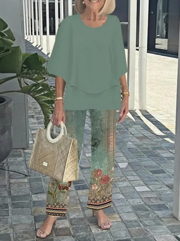 夏の新 2 点セット女性の O ネック 3/4 袖プリントパンツスーツカジュアルルーズ不規則なトップ + ワイドレッグパンツ 2 点セット