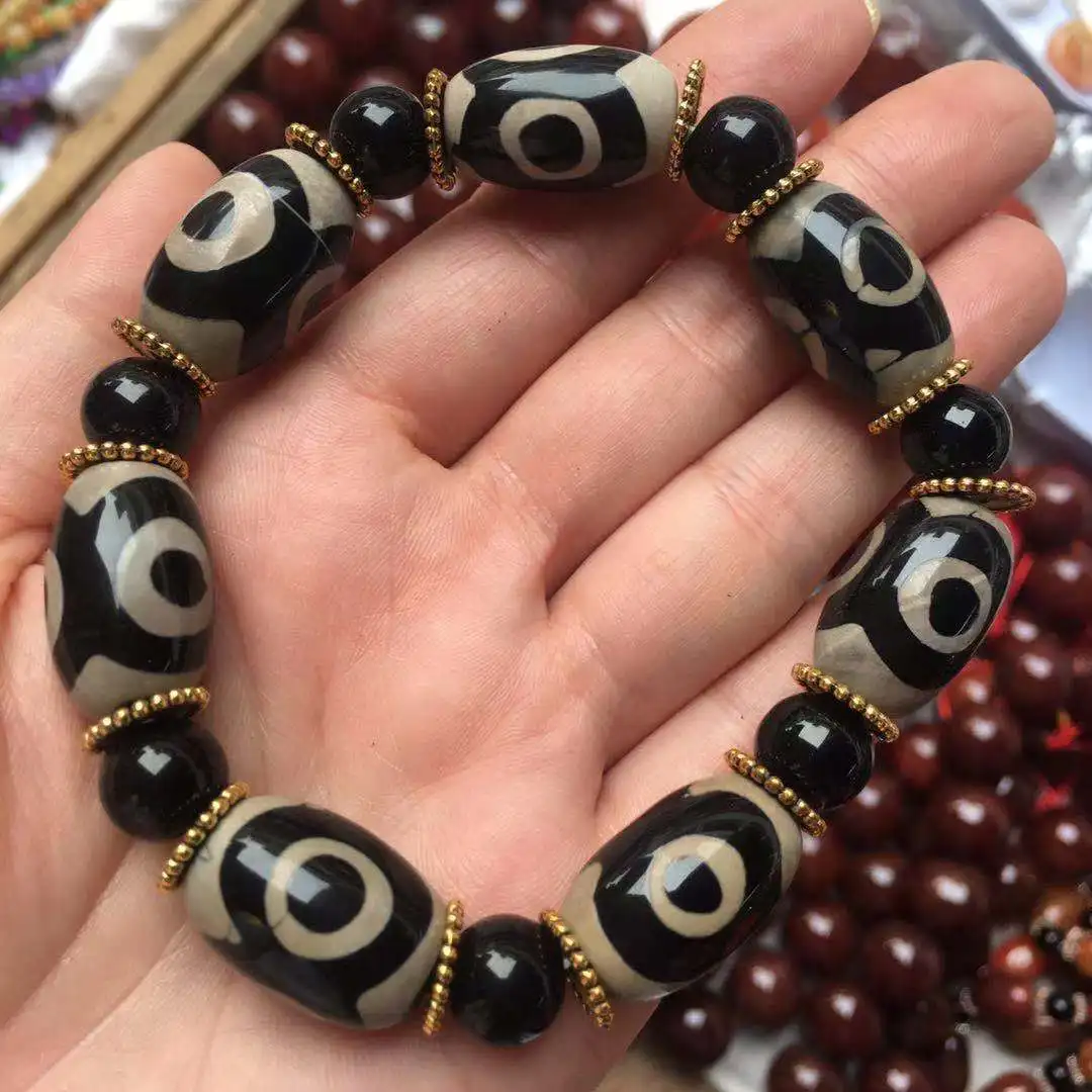 

Tibetan style three-eyed dzi agate bracelet high oil coated pulp Taiwanese craft fashion ethnic style dzi bracelet men's models