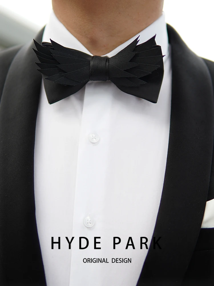 Banquet host with a luxurious black bow tie, wedding groom bow tie, and floral collar