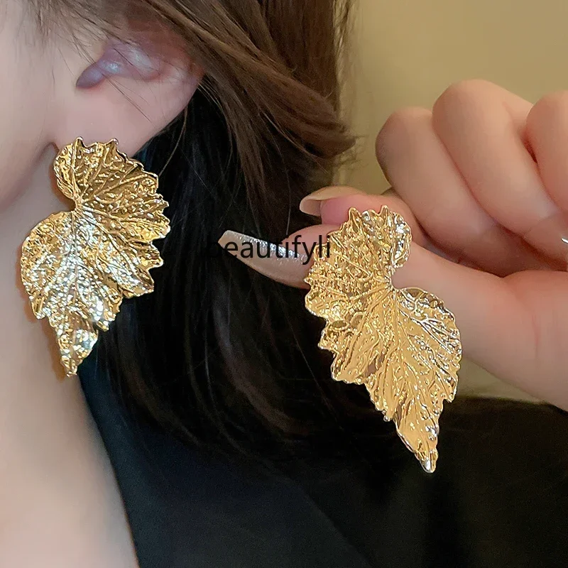 

Exaggerated metal leaf big stud earrings, high-end earrings, unique gold earrings for womenHY