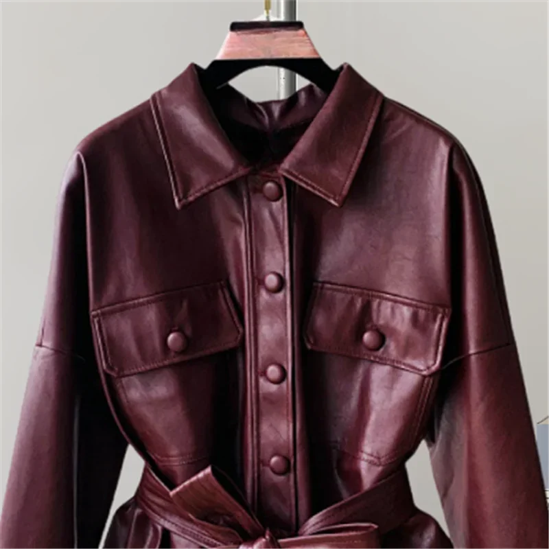ใหม่กลางยาวผู้หญิง Faux PU หนังแจ็คเก็ตเข็มขัดสีดําไวน์แดง Casual Lapel Single-breasted แขนยาวเสื้อหนังปลอม