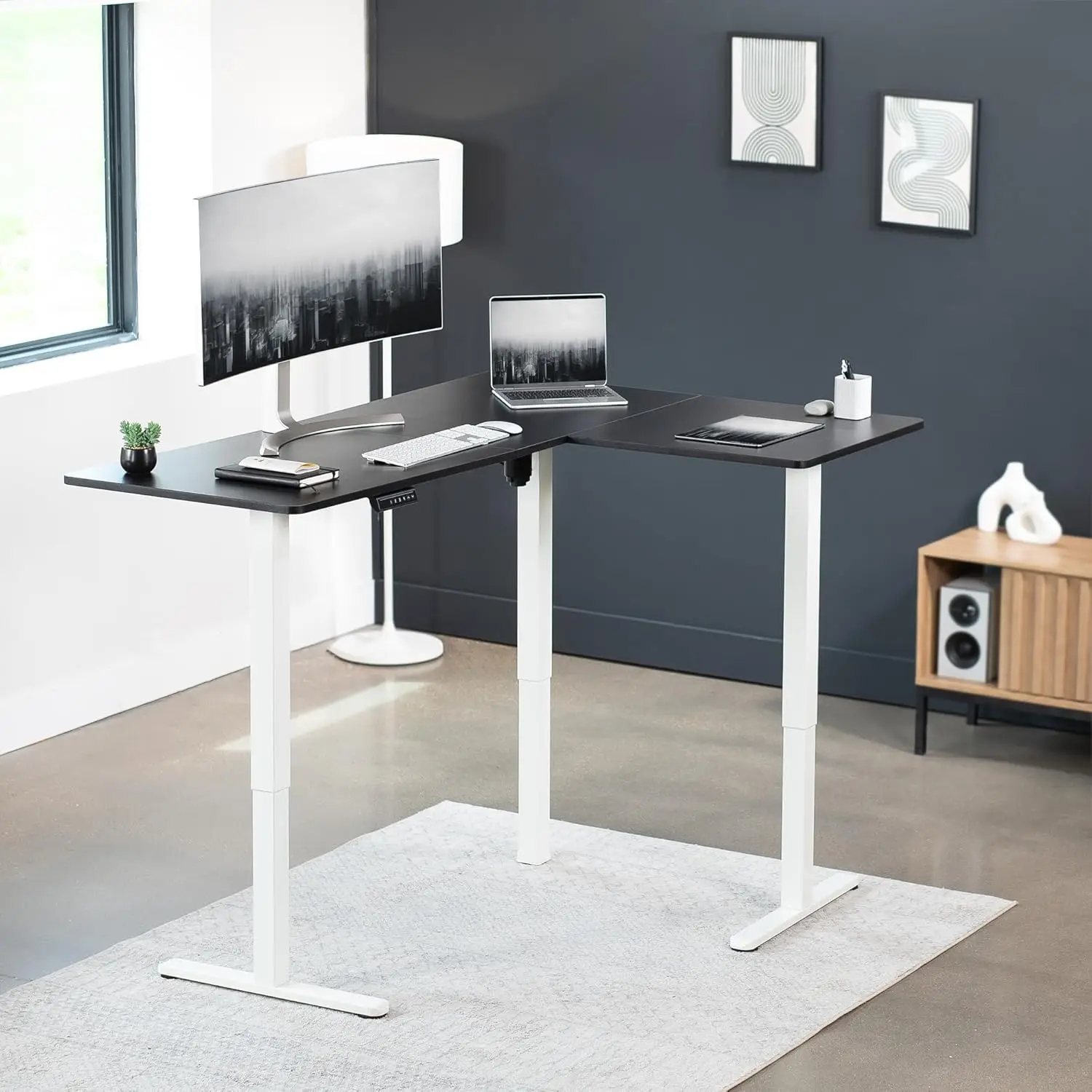 Electric L-shaped 63 x 47 inch standing desk with adjustable height, memory controller, black top and white frame