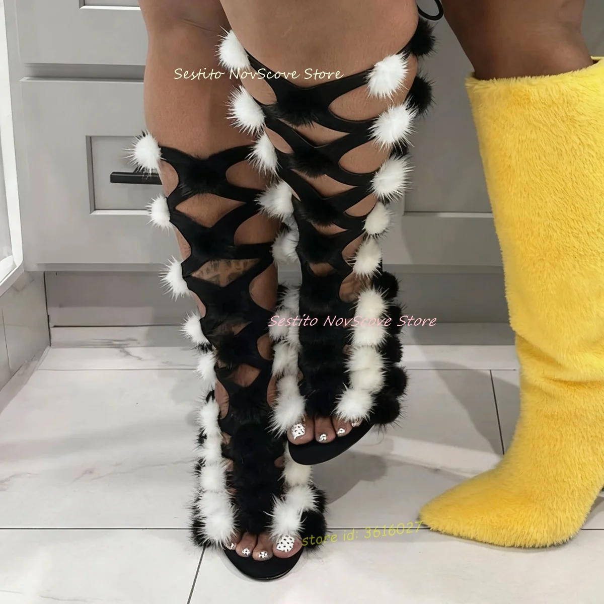 

Black and White Fur Ball Gladiator Knee High Sandals Open Toe Cutouts Back Lace Up Stiletto High Heels Sexy Women Party Booties