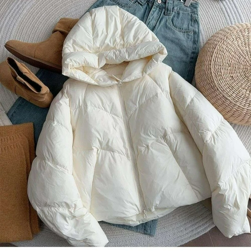 

A Short White Hooded Cotton-padded Coat for Women in The 2026 Winter A New Style of Winter Bread Cotton-padded Jacket Warm Top