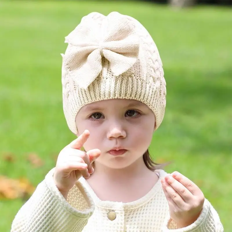 Cappello lavorato a maglia in unita Cappello lavorato a maglia con fiocco per bambini Casual all'aperto Autunno e inverno