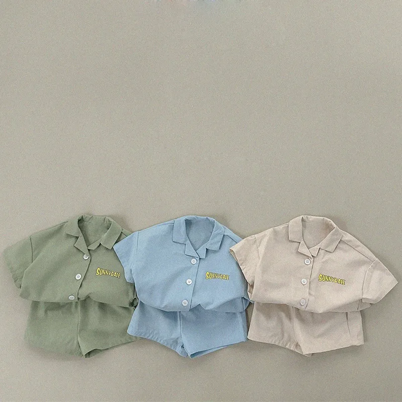 

2026 Summer New Children Casual Clothes Set Boys Girls Cute Letter Print Lapel Shirts + Shorts 2pcs Suit Cotton Toddler Outfits