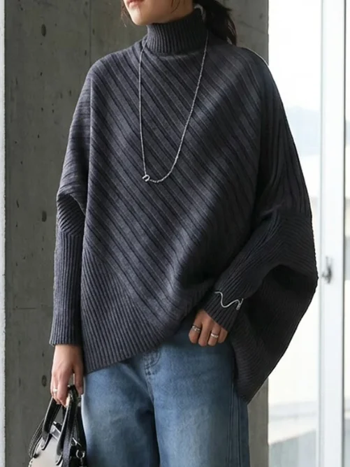 เสื้อไหมพรมคอสูงทรงปีกค้างคาวแบบอสมมาตรสำหรับผู้หญิง สวมใส่สบาย ทรงหลวมทันสมัย ผลิตจากโพลีเอสเตอร์ แขนยาว ให้ความอบอุ่น