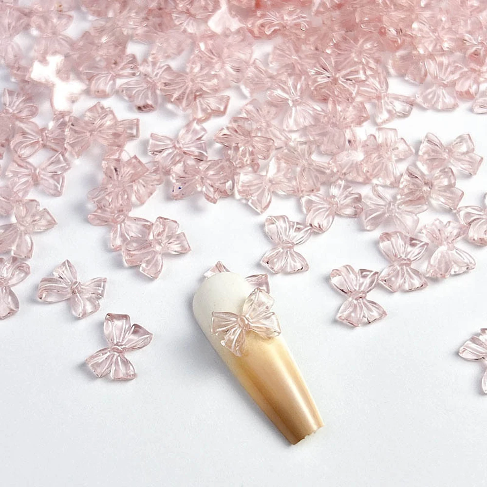 100Pcs 핑크 화이트 투명 리본 활 네일 아트 매력 3D 수지 Kawaii 지우기 Bowtie 네일 장식 DIY 매니큐어 액세서리