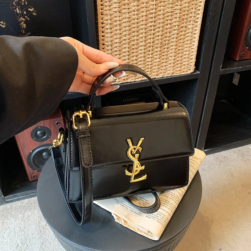 

Spring Top-Handle Bag, Compact Square Shape, Adjustable Crossbody Strap, Luxe Textured Finish, Modern Classic, New 2026