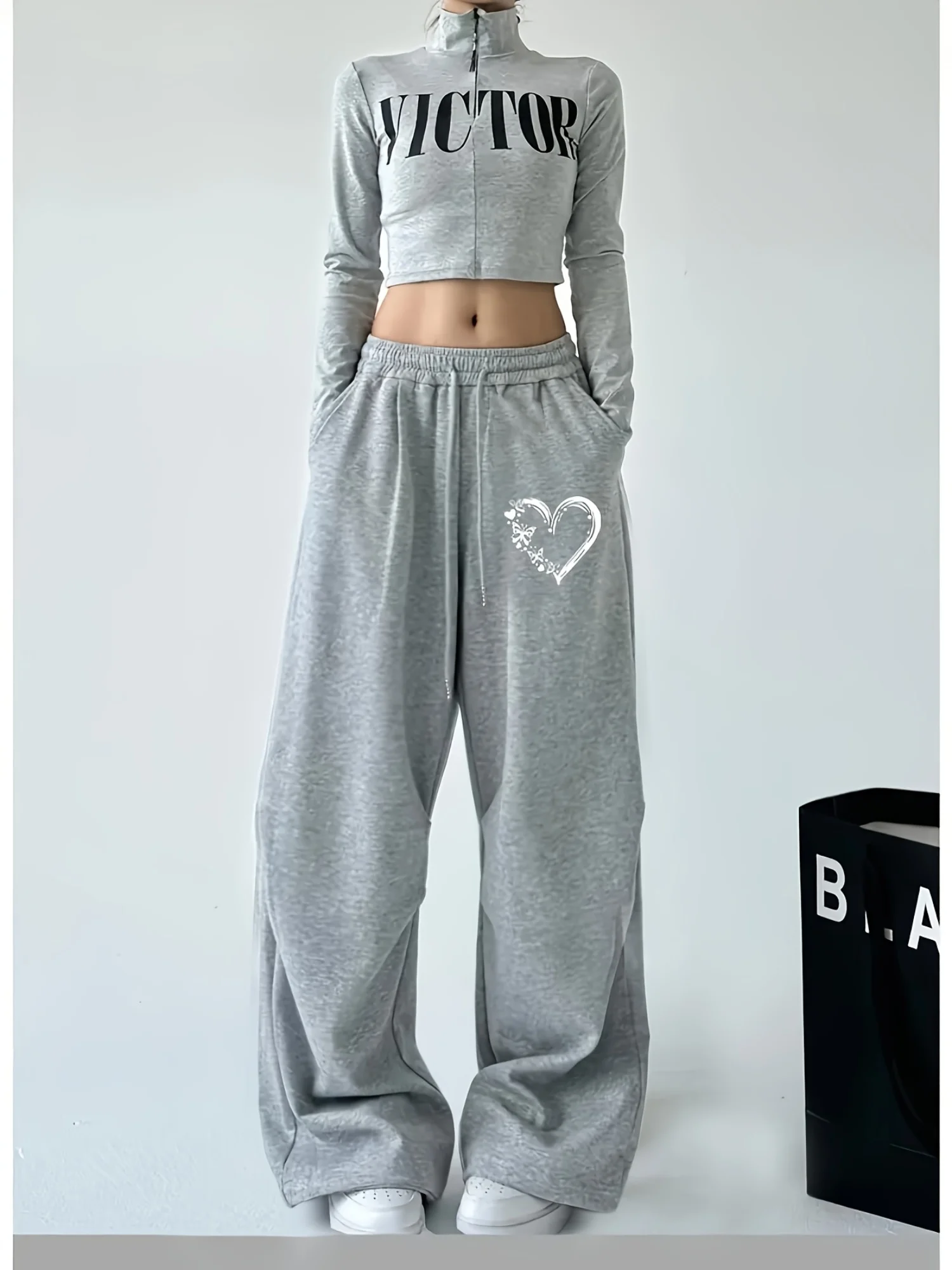 Damen Herbst und Winter Plus-Size-Herzdruck Lose gerade Fleece-Bein-Jogginghose Elastischer Bund Streetwear Vielseitig