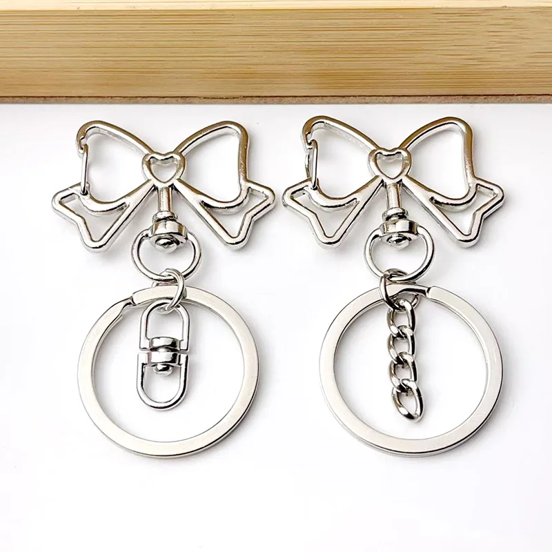 Image of 6-12 Stück Bogen Schlüsselanhänger Figur Acht Schnalle Stern Schlüsselanhänger Auswurfsschnalle DIY Spielzeug Schmuck Anhänger Link Herstellung Großhandel