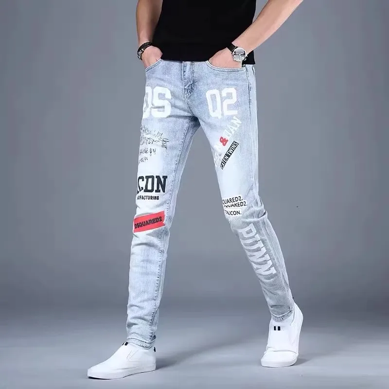 Moda Koreańskie Dżinsy Męskie Graffiti Nadrukowane Litery Spodnie Dżinsowe Męskie Streetwear Slim Fit Niebieskie Dżinsy Hip hop Małe Spodnie Stóp