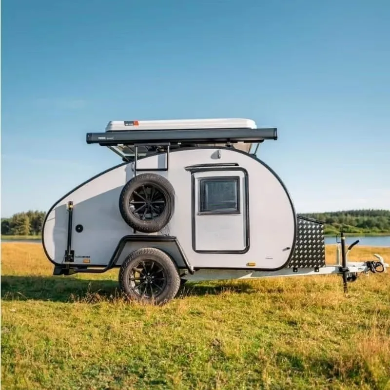 Custom Travel Trailer Camper Van RV Motorhome for Road Trip Camping with Sleeping Platform and Organized Storage Space