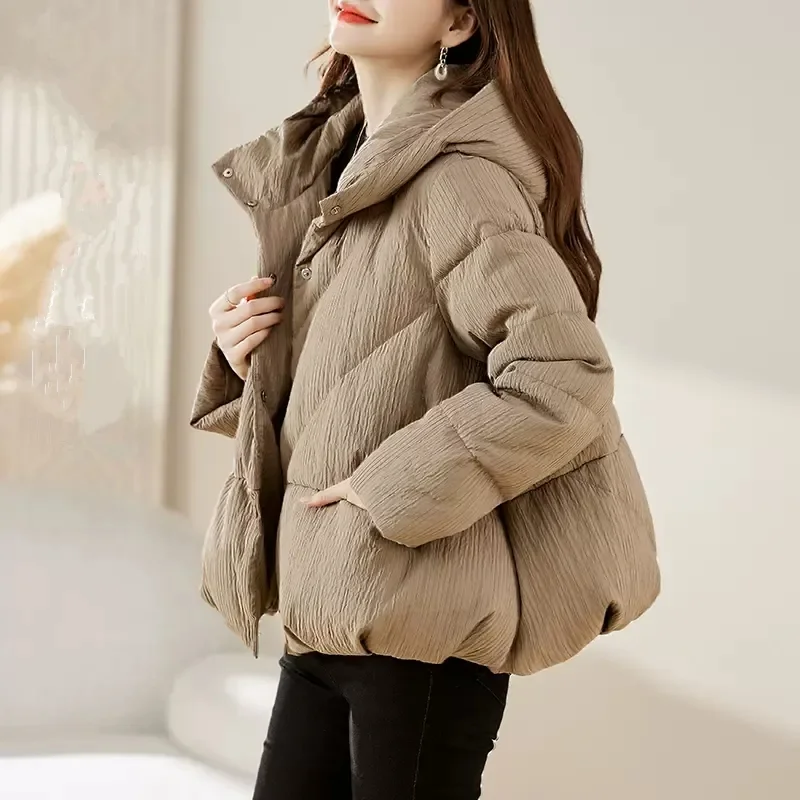 Piumino in cotone leggero con cappuccio Parka coreano da donna con cerniera invernale 2025 Nuovo cappotto caldo allentato e spesso alla moda Capispalla W1409