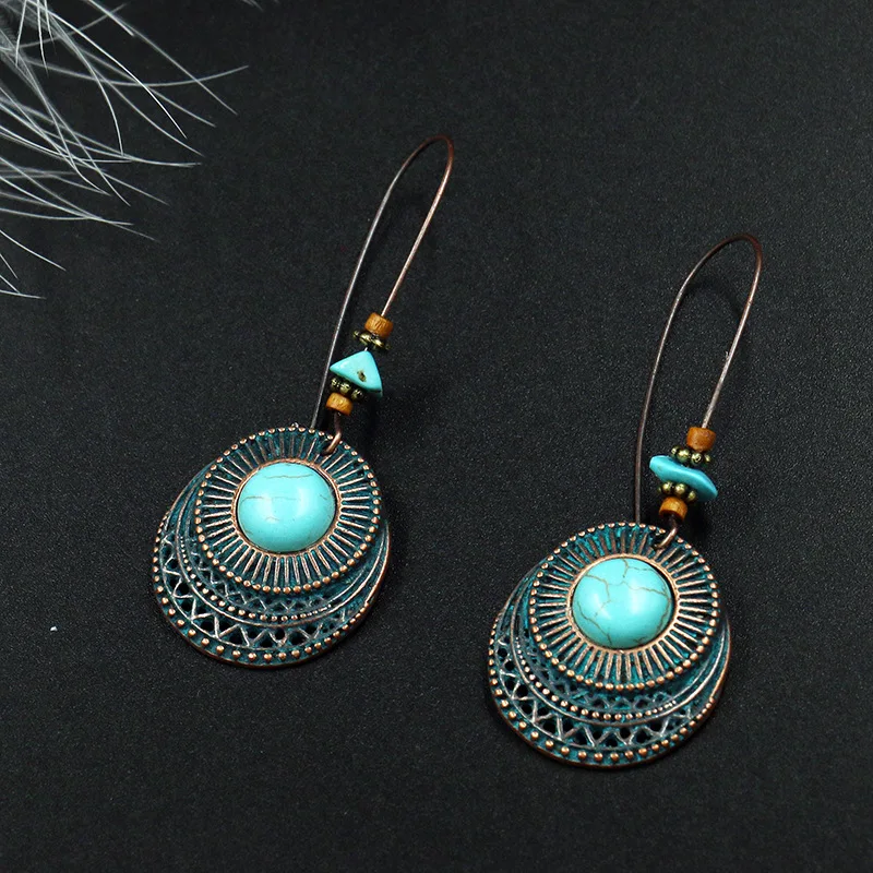 Design inspired turquoise metal earrings with multiple layers of circular hollow carvings trendy and versatile earrings