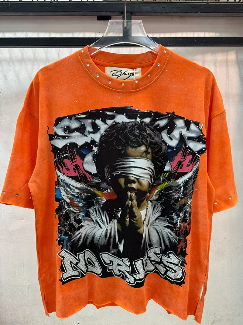 Übergroßes Orange Strass Washed T-Shirt mit Engelsflügeln und Graffiti Lustiges Grafik-T-Shirt für Männer und Frauen Sommer Lässiges Baumwoll-Kurzarm-Oberteil – Detail 2