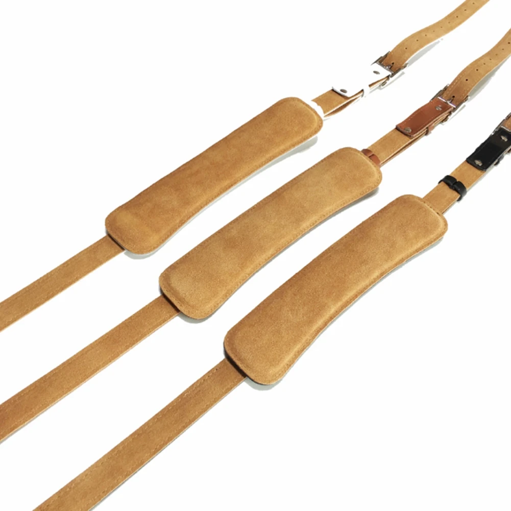 แผ่นสายรัดกีตาร์ไฟฟ้าที่ทนทานสำหรับหนังและหัวเข็มขัดโลหะวินเทจปรับสีขาวสายคล้องกีตาร์