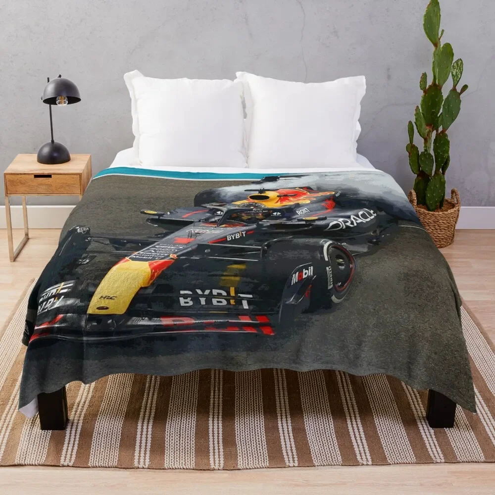 

Max Verstappen celebrating his 3rd world championship by doing donuts after winning the 2023 Abu Dhabi Grand Prix Throw Blanket