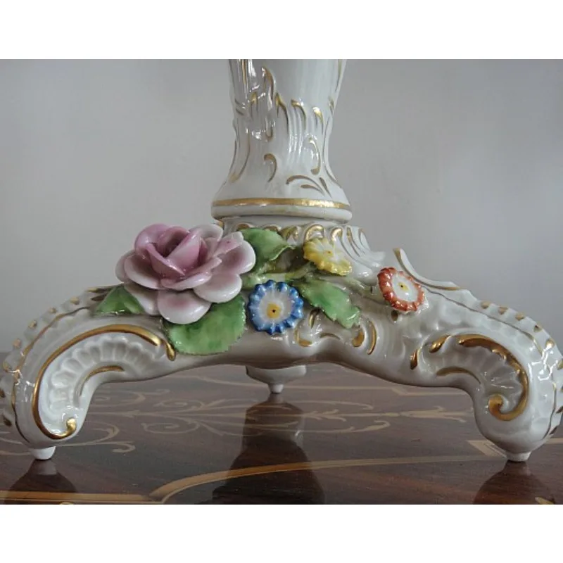 A pair of fine porcelain candle holders