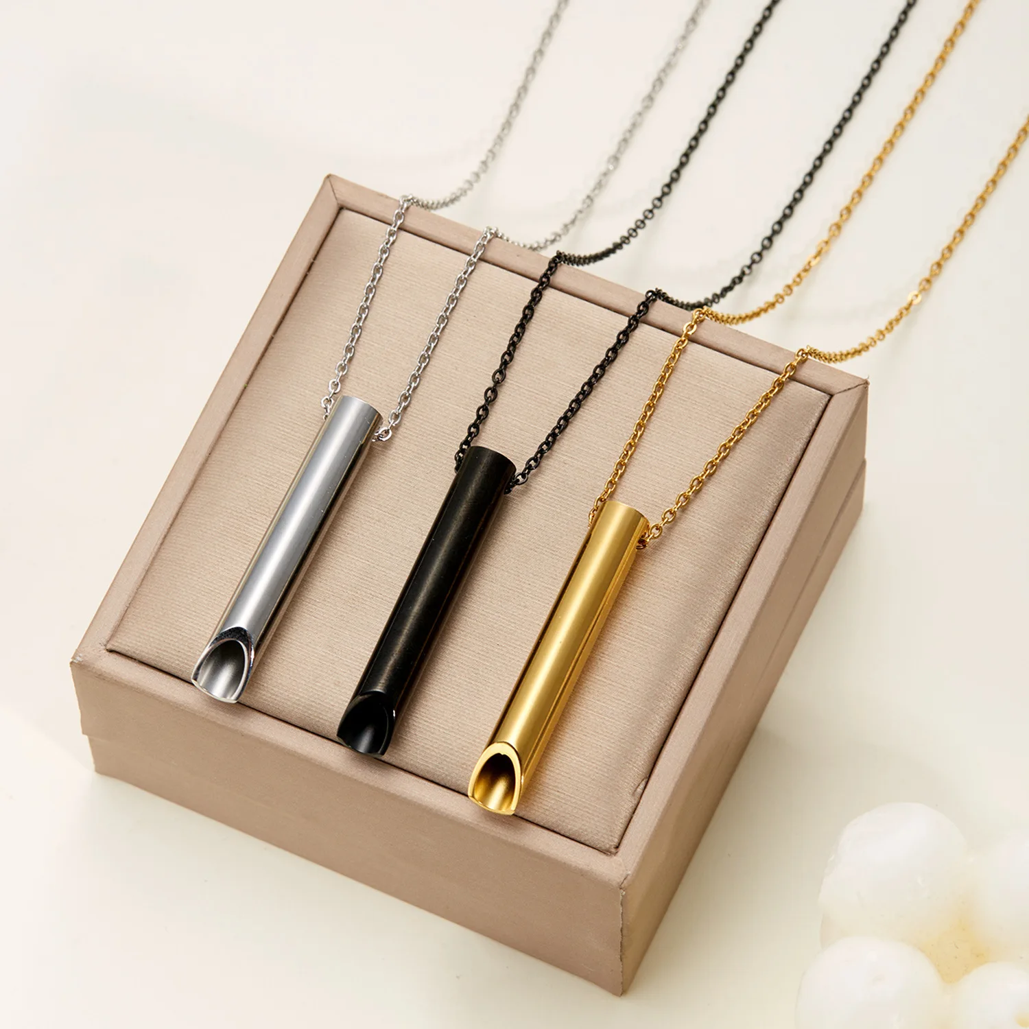 Factory direct sales of new stainless steel meditation whistle necklace, versatile creative breathing whistle necklace wholesale