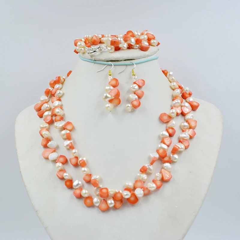 

High quality women's wedding jewelry set. 9MM natural baroque pearls and orange coral. Necklace/Bracelet. earrings