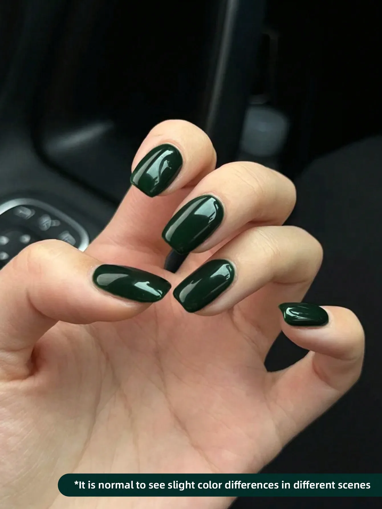 Close‑up of dark green gel nail polish finish