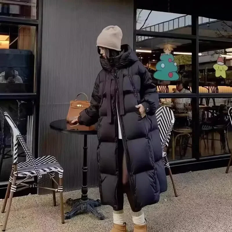 2025 Nuova giacca invernale in cotone Cappotto lungo da donna Edizione coreana Giacche larghe e spesse con cappuccio Cappotto Parker caldo femminile