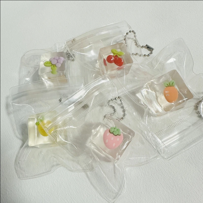 アイスキューブ＆フルーツスクイーズキッズドールキーホルダー - 鼻くそ型ストレス解消おもちゃ、ゆっくり戻る必須アイテム