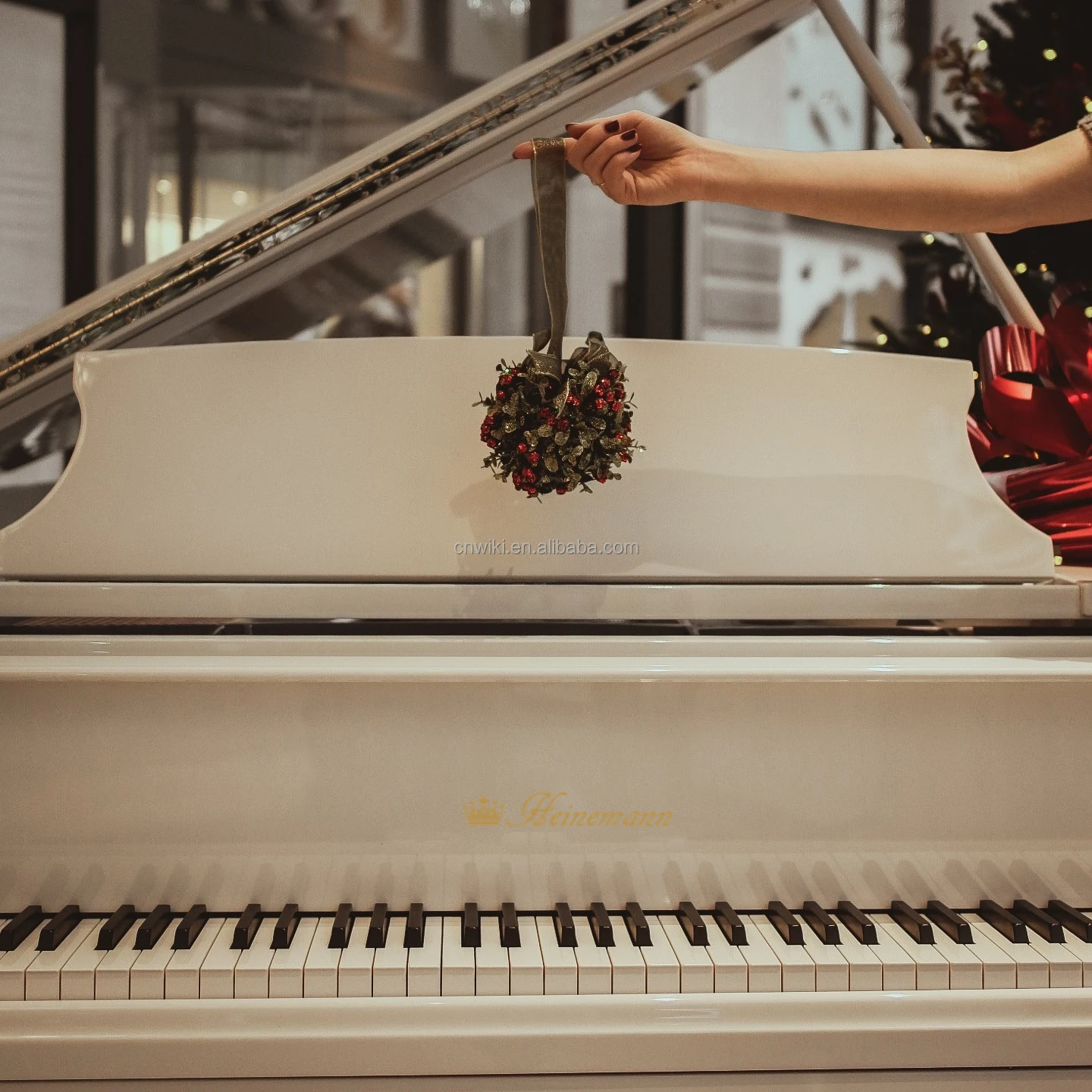 White Baby Grand Piano With The Disc Player