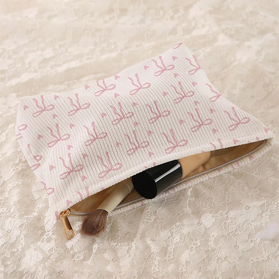 Tas makeup korduroi dengan ritsleting bermotif pita merah muda yang dirancang secara minimalis, tas penyimpanan kosmetik yang ringan dan multifungsi
