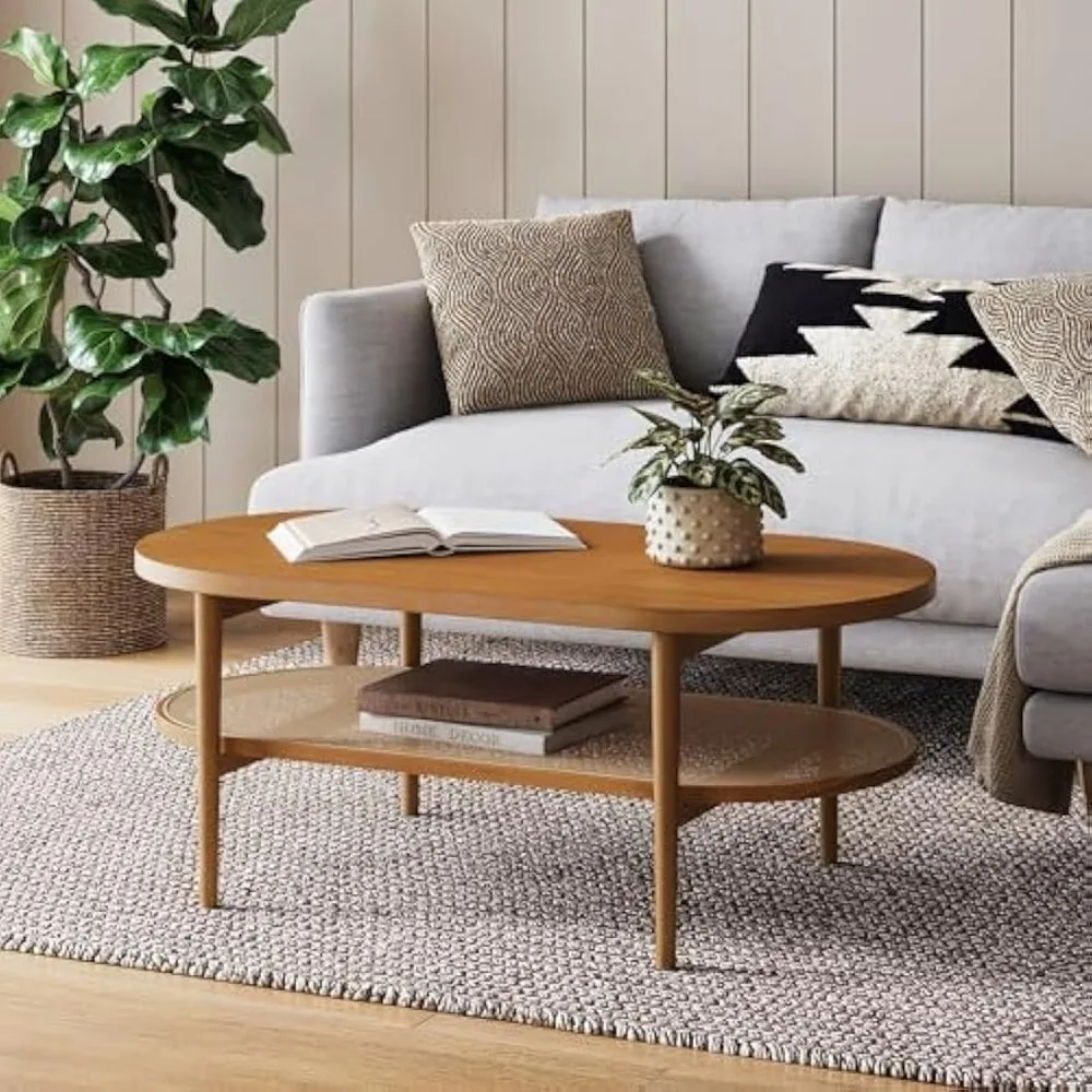 

2-Tier Oval Coffee Table, Living Room Cane Table with Storage Shelf and Mid-Century Legs in Honey Brown Wood with Rattan Accent