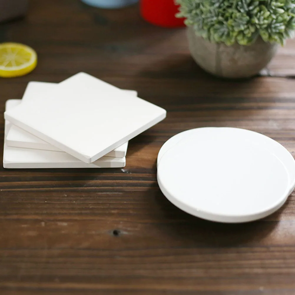 

12pcs Simple Ceramic Coasters Home Cork Bottom Heat Insulation Cup Mats Table Protection Party Supplies White Absorbent Coasters