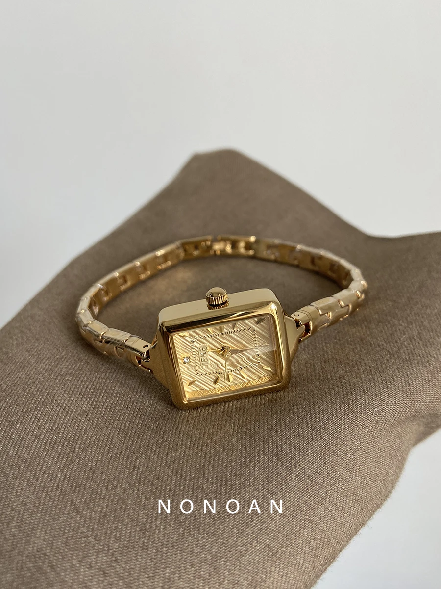 A sophisticated women's watch with a delicate bracelet and square dial, exuding elegance and style. A perfect gift for ladies.
