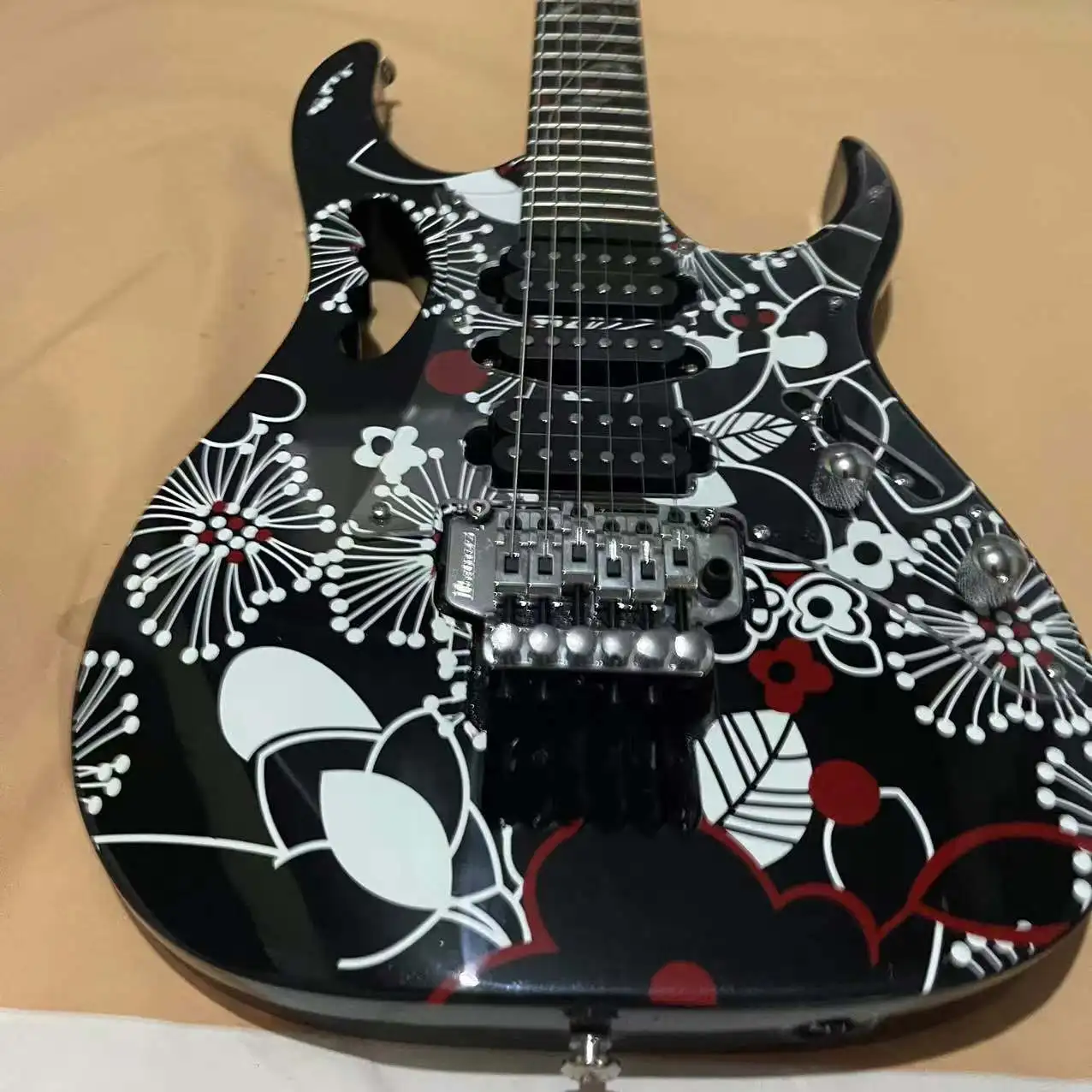 In stock, 6-chord shaped electric guitar with black cherry blossom pattern body and chrome plated hardware accessories. Real pic