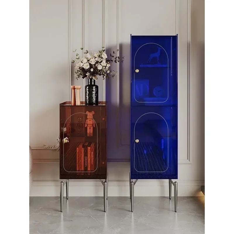 The living room entrance is against the wall,   cabinet is in the aisle