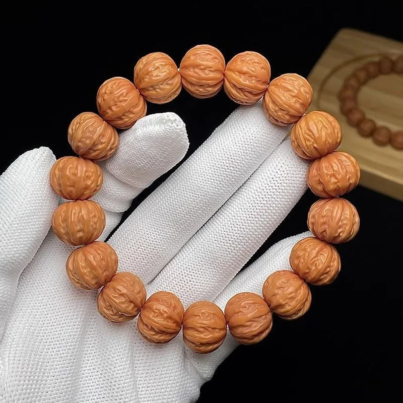 

Monkey Head Carved Walnut Bracelet Jingbaleng Pumpkin Pile Phoenix Feather Monkey Head Tyrant String Original Seed Single Circle