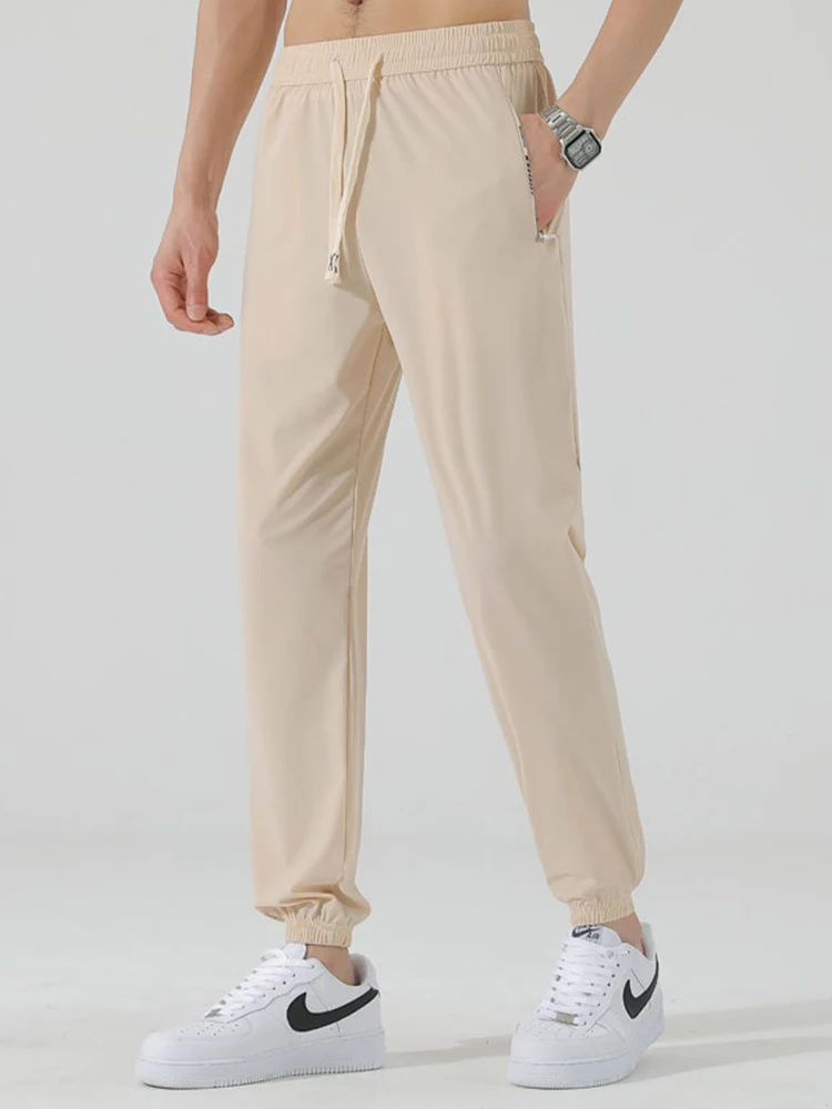 Pantalones de chándal finos de seda de hielo para hombre, pantalón de chándal informal de nailon elástico de secado rápido, novedad de verano, 2024