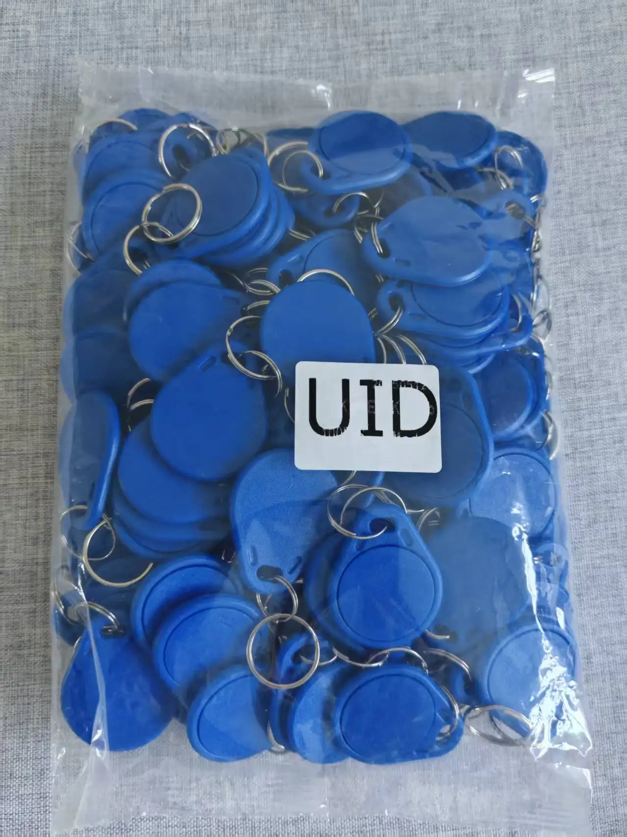 100 pièces étanche réinscriptible UID NFC étiquette Clone copiable UID porte-clés 13.56MHz RFID porte-clés pour contrôle d'accès et systèmes de sécurité
