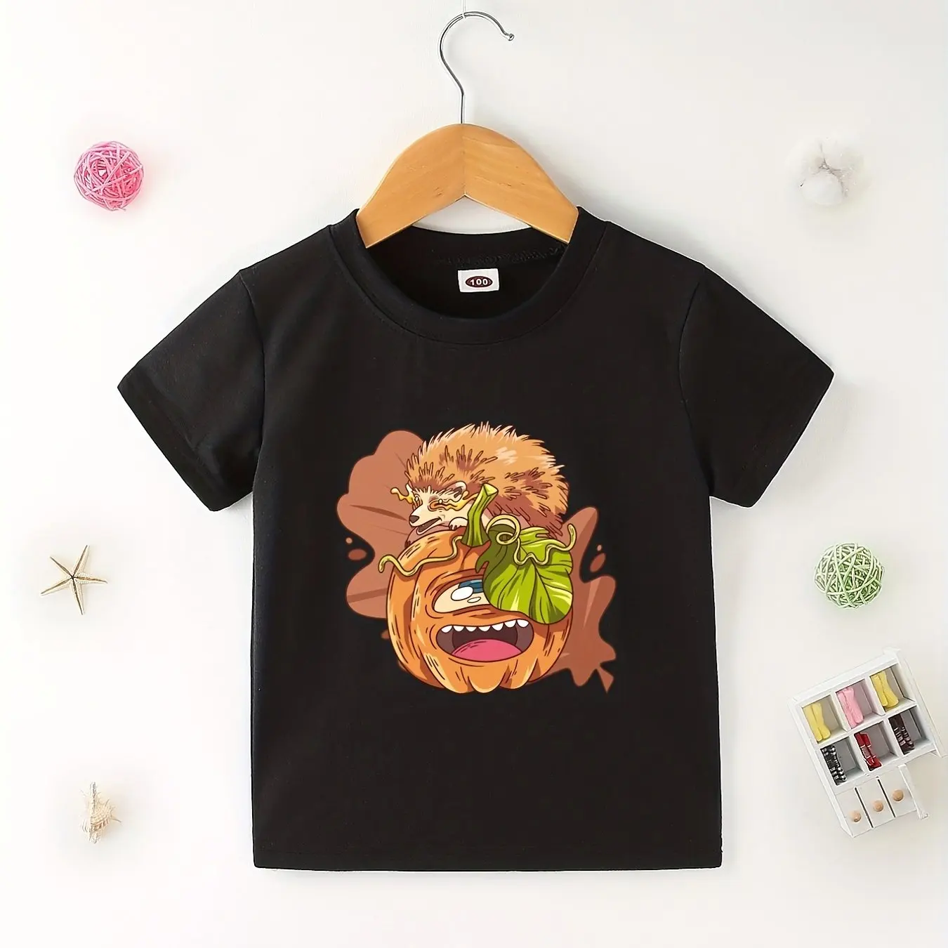 

Kids Halloween T-Shirt Featuring Humorous Hedgehog and Pumpkin Design in Soft Cotton Ideal for Festive Celebrations