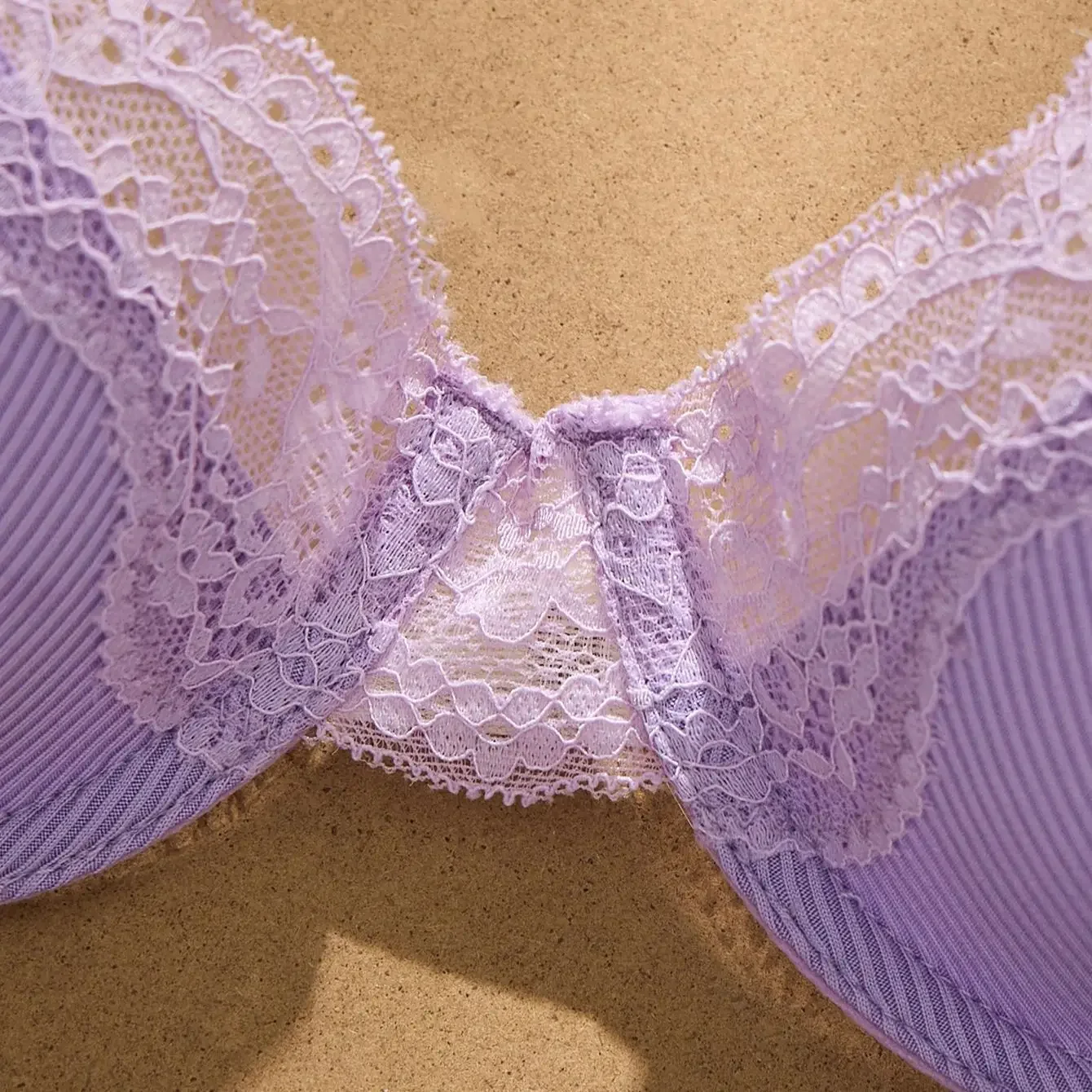 Adjustable strap detail with soft purple fabric and comfortable back fit