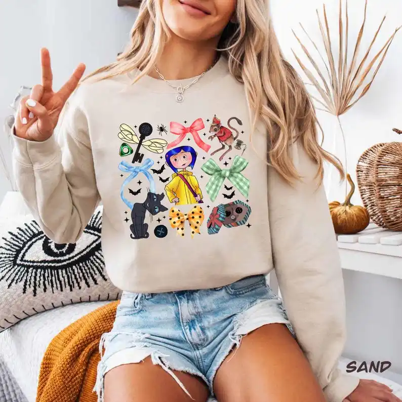 

Coquette Bow Coraline Cartoon Sweatshirt, Vintage Coraline Halloween Hoody , Doll Best for Coraline Movie Fan Gift man and woman