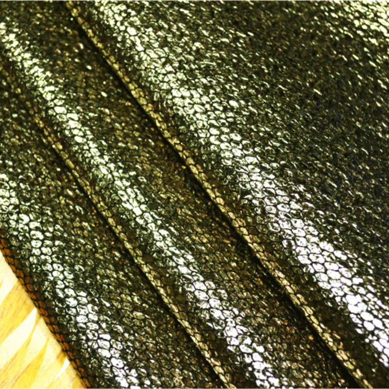 

A black base with antique bronze and golden dots fashion fabric coarse-blended woolen coat skirt