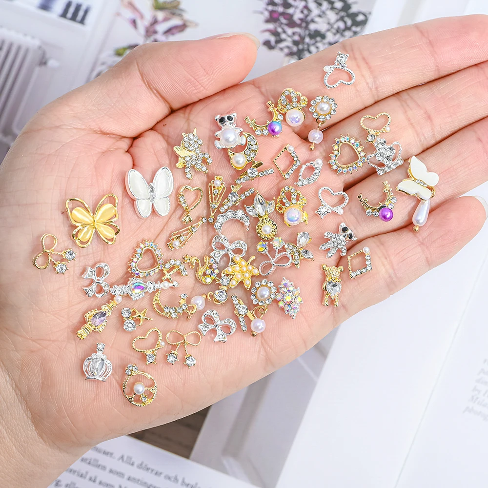 50Pcs 3D Mixed Stil Luxus Zirkon Diamant Nail art Charms Hohl Baumeln Piercing Schmuck Anhänger Herz Bowknot Nagel Dekoration