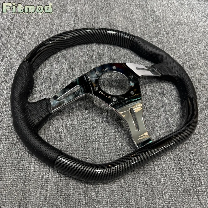 14-inch 350mm D-shaped semi-circular carbon fibre wrapped steering wheel with polished chrome spokes and black leather