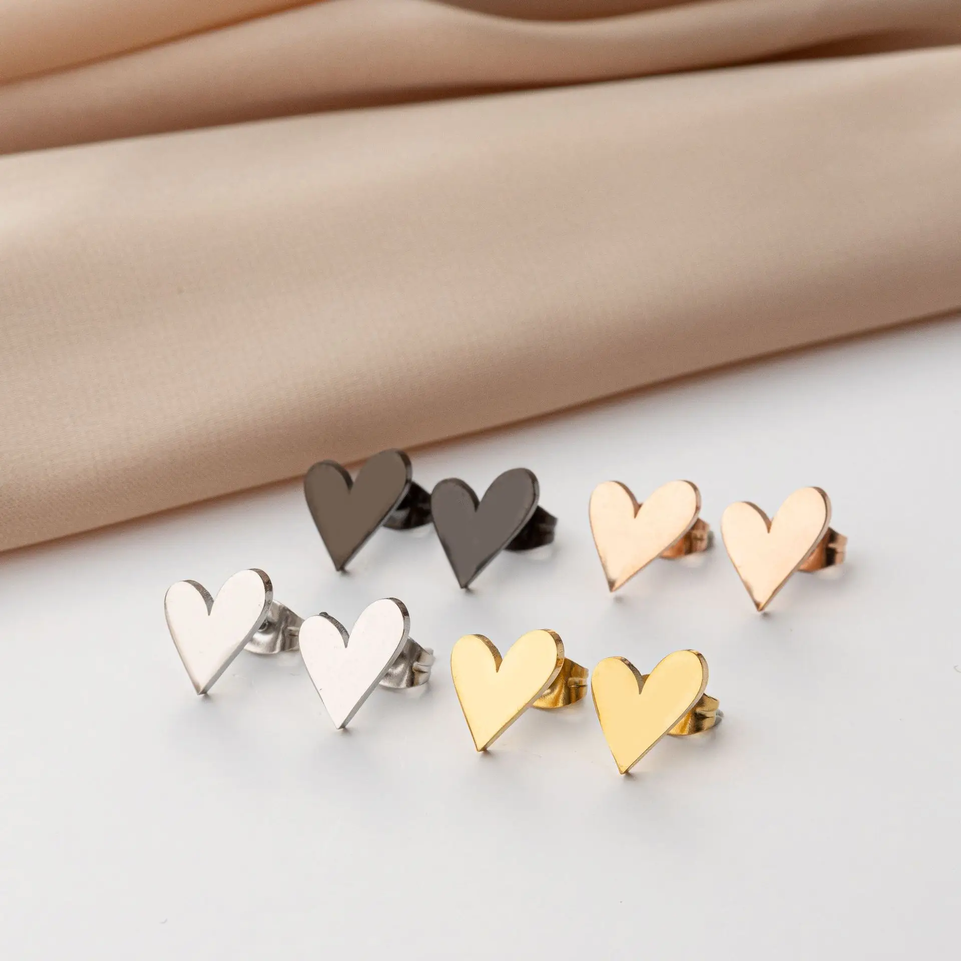 Cross-border European and American fashion gold ins love stud earrings plated with 18K stainless steel light luxury simple geome