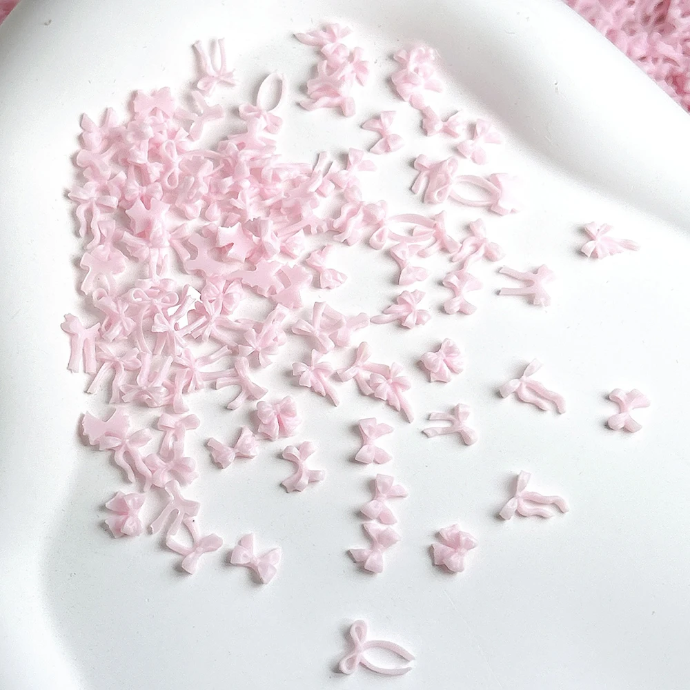 50 stücke Mix Stile Rosa Bowknot Nagel Charms Band 3D aushöhlen Kawaii Nagel Dekorationen Harz Bogen Schmetterling Maniküre diy Teile