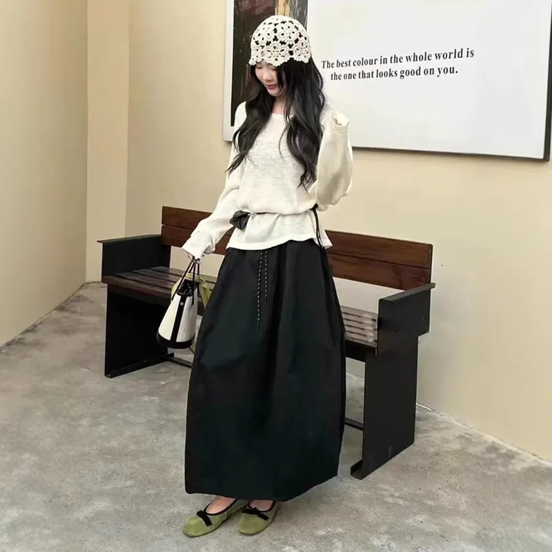 الأدوات تنورة المرأة أوائل الخريف جديد عالية الخصر تنورة منفوشة الرباط كلمة تنورة متوسطة وطويلة